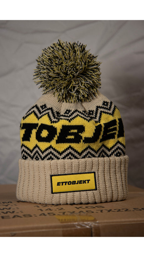 Ettobjekt mössa med toffs, Beige